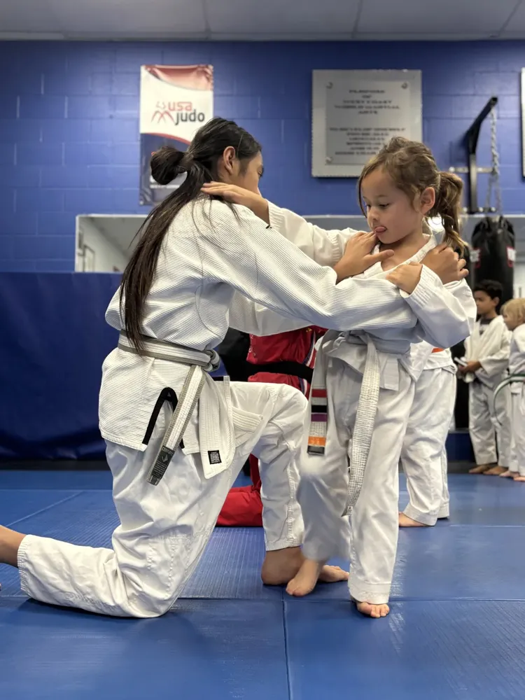 Two students working a partner self defense drill at Fusion Elite
